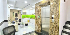 Nhà riêng: Nhà 4,5 tấm, 7 phòng, có thang máy, đường Nguyễn Thị Tú