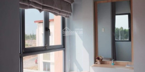 Cần bán nhà mới xây 1 trệt 1 lầu,đường nhựa trước nhà 13m tại Bến Cát Bình Dương